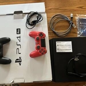 Sony PS4 Pro Console with Red and Black Controllers